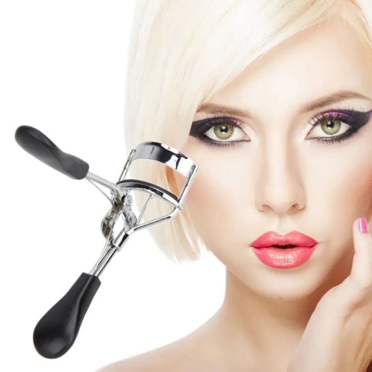 Woman with makeup tools on a white background