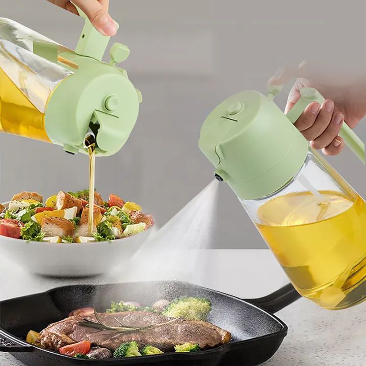 2-in-1 glass oil sprayer bottle in spray mode over a salad