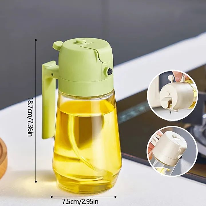 2-in-1 glass oil sprayer bottle in spray mode over a salad