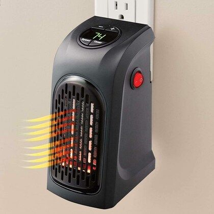 400W portable mini room heater on table