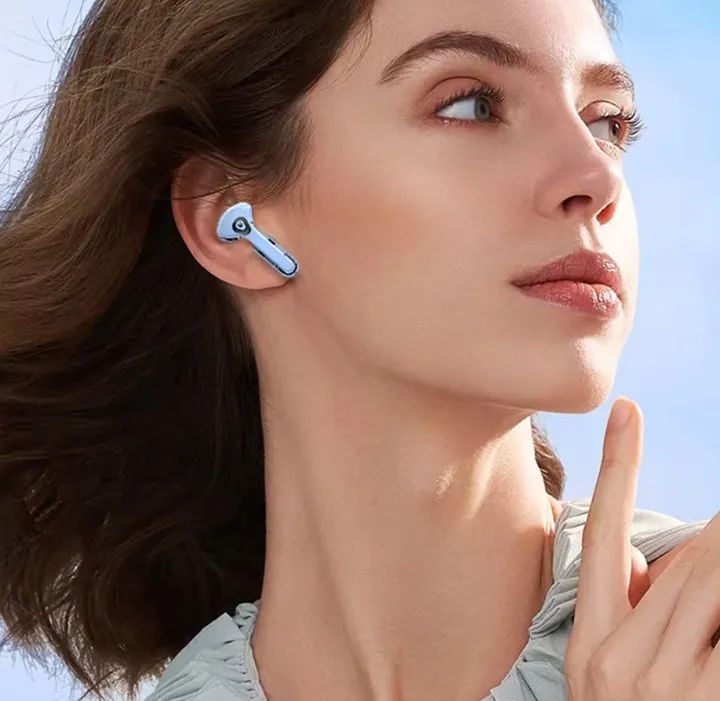 Person wearing the stylish transparent Air 39 Pro wireless earbuds during a workout