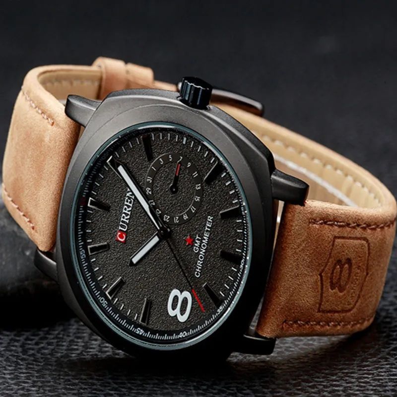 Close-up of the brown leather strap and buckle on the Curren watch