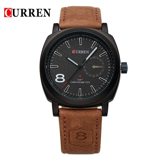 Curren men's watch with black dial and brown leather strap on wrist