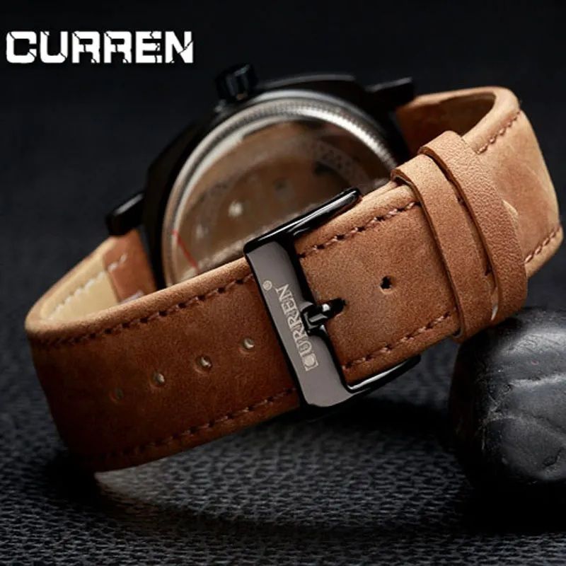 Close-up of the black dial and details of the Curren watch