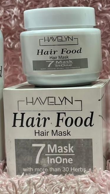 Havelyn Hair Food hair mask jar and box on a textured pink background
