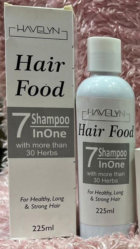 Havelyn Hair Food shampoo bottle and box on a pink textured background
