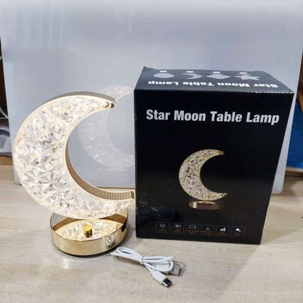 Moon table lamp as a decorative piece on a living room shelf