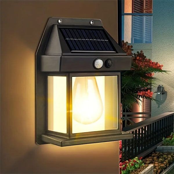 Solar powered motion sensor wall lamp mounted on an outdoor wall